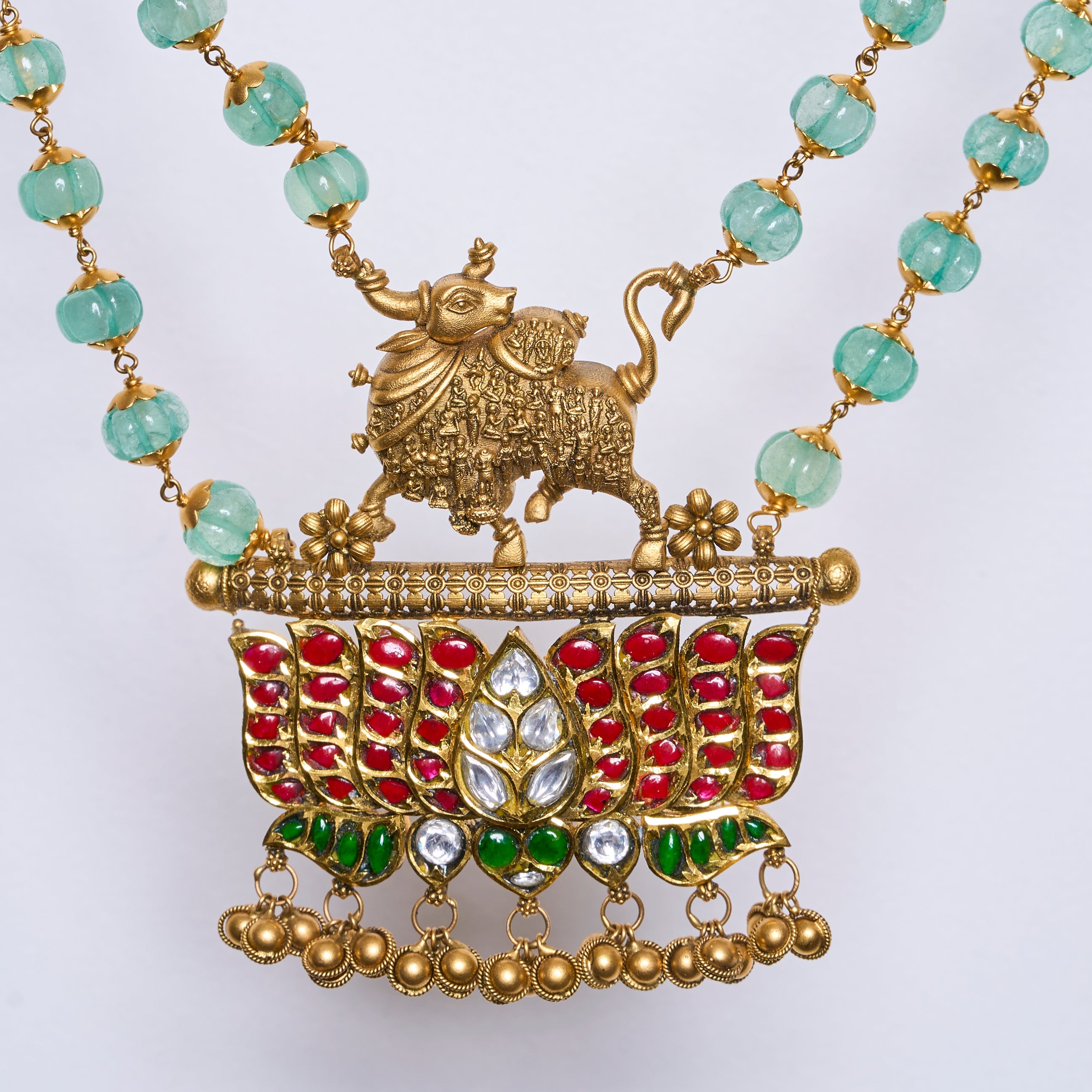 Traditional Kamdhenu temple necklace with emerald beads, ruby and polki work in antique gold