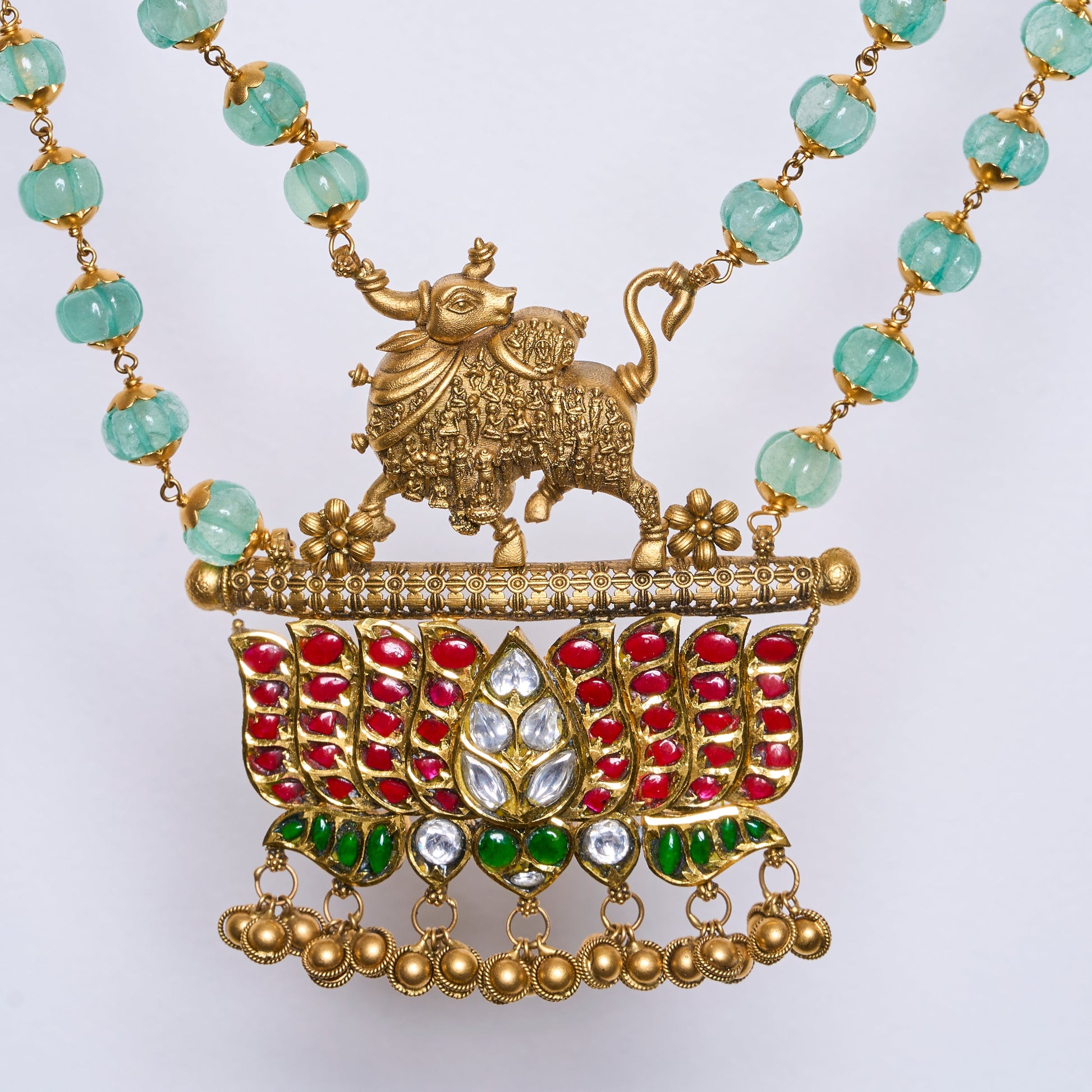 Traditional Kamdhenu temple necklace with emerald beads, ruby and polki work in antique gold