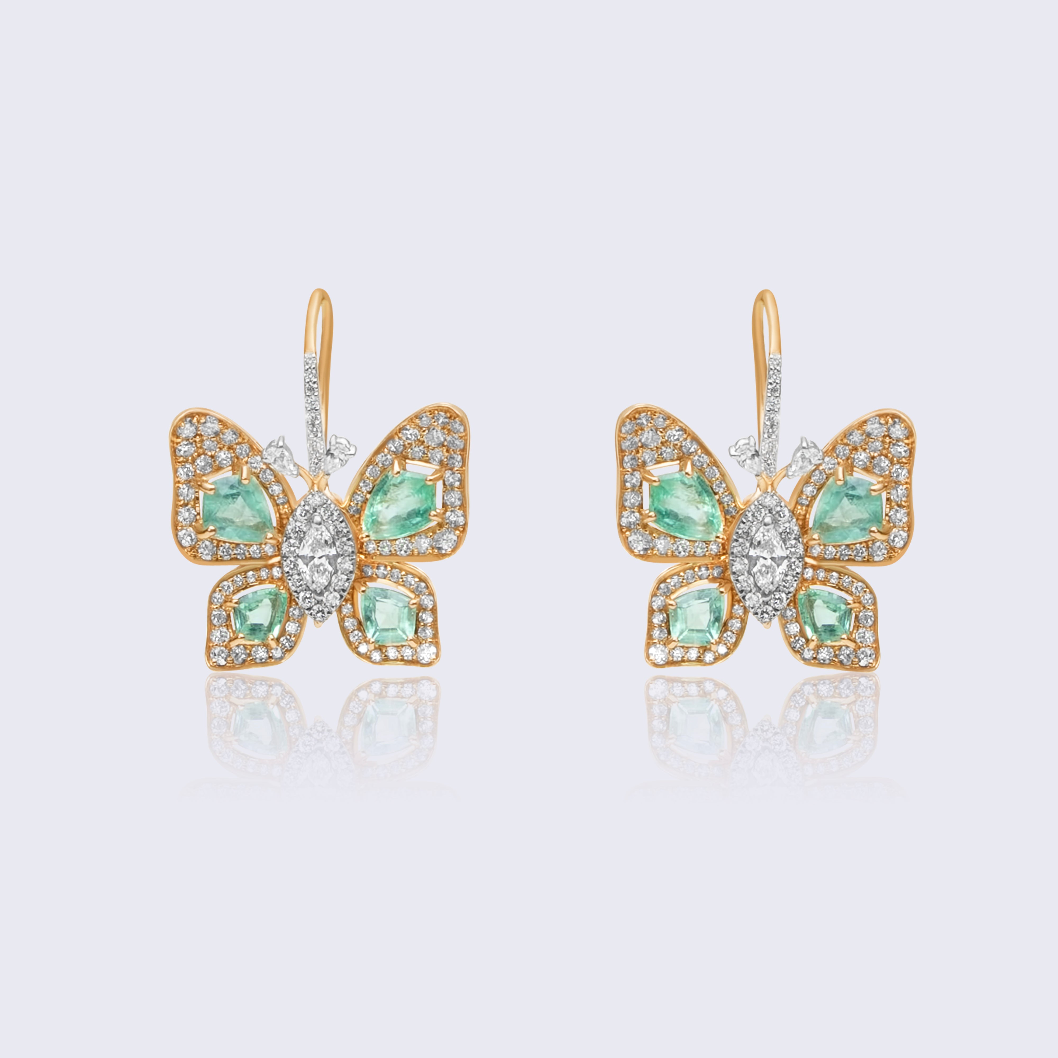 Luxurious 14K gold emerald butterfly diamond earrings with green emerald wings and brilliant diamond halo setting