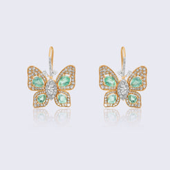 Luxurious 14K gold emerald butterfly diamond earrings with green emerald wings and brilliant diamond halo setting