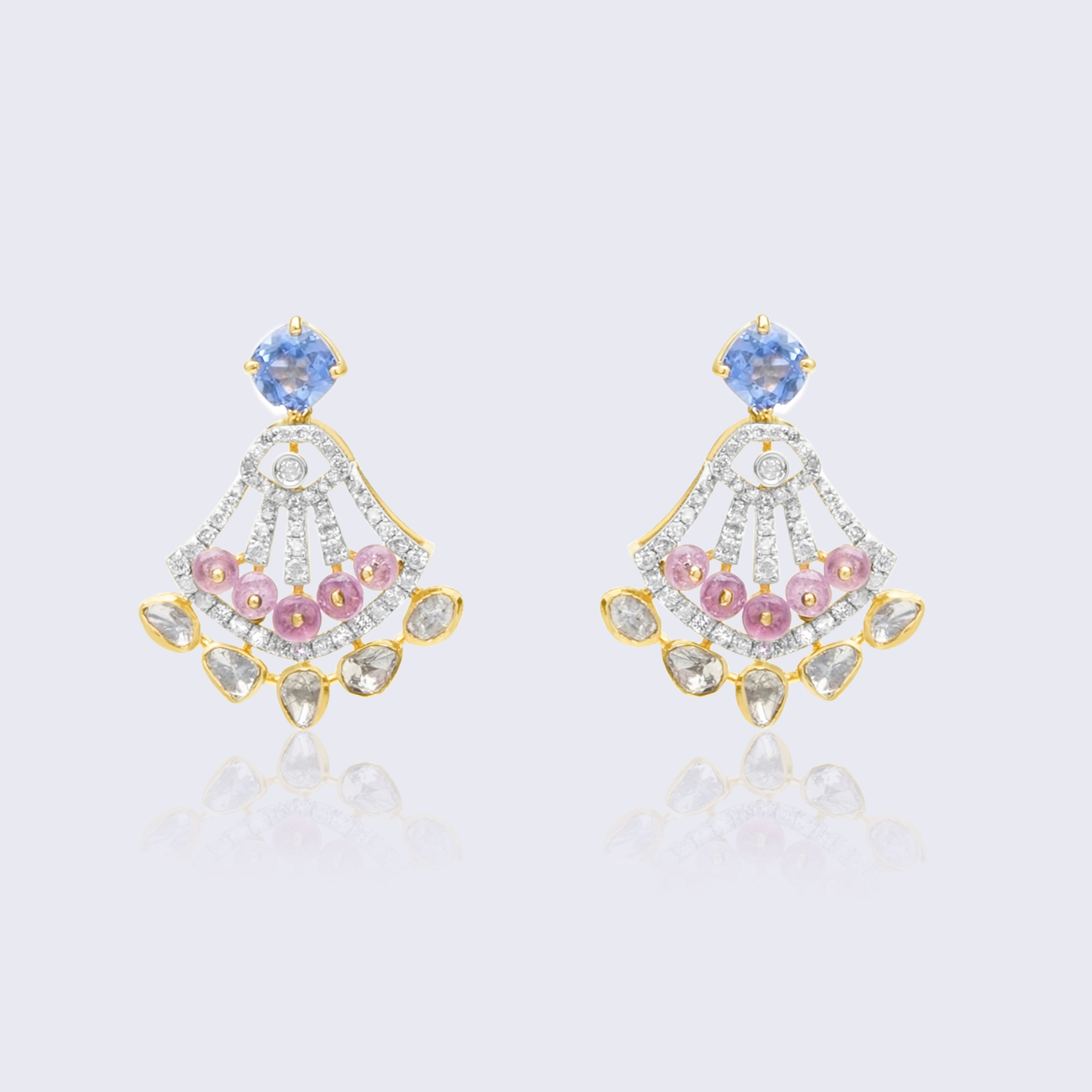 Stunning 18K gold sapphire polki art deco fan earrings with blue sapphire centers, pink ruby accents, and polki diamond base