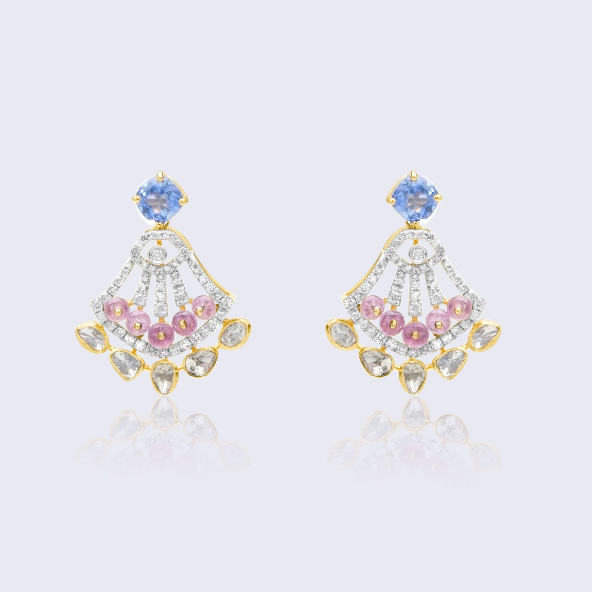 Stunning 18K gold sapphire polki art deco fan earrings with blue sapphire centers, pink ruby accents, and polki diamond base
