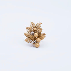 Ring with textured floral discs, smooth gold beads, and delicate pave accents, crafted in 22K gold.
