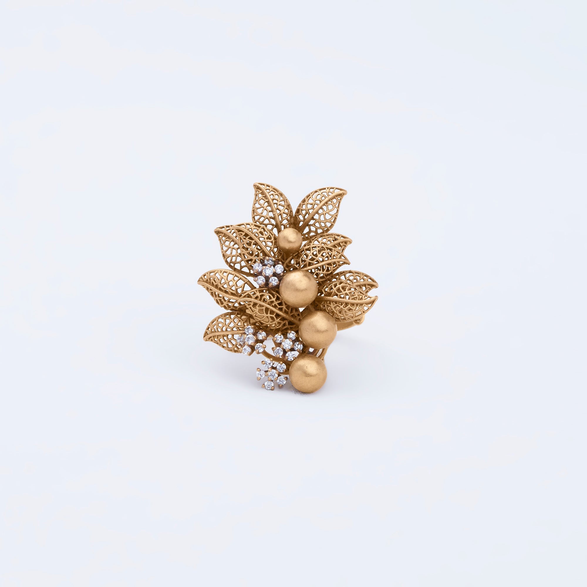 Ring with textured floral discs, smooth gold beads, and delicate pave accents, crafted in 22K gold.