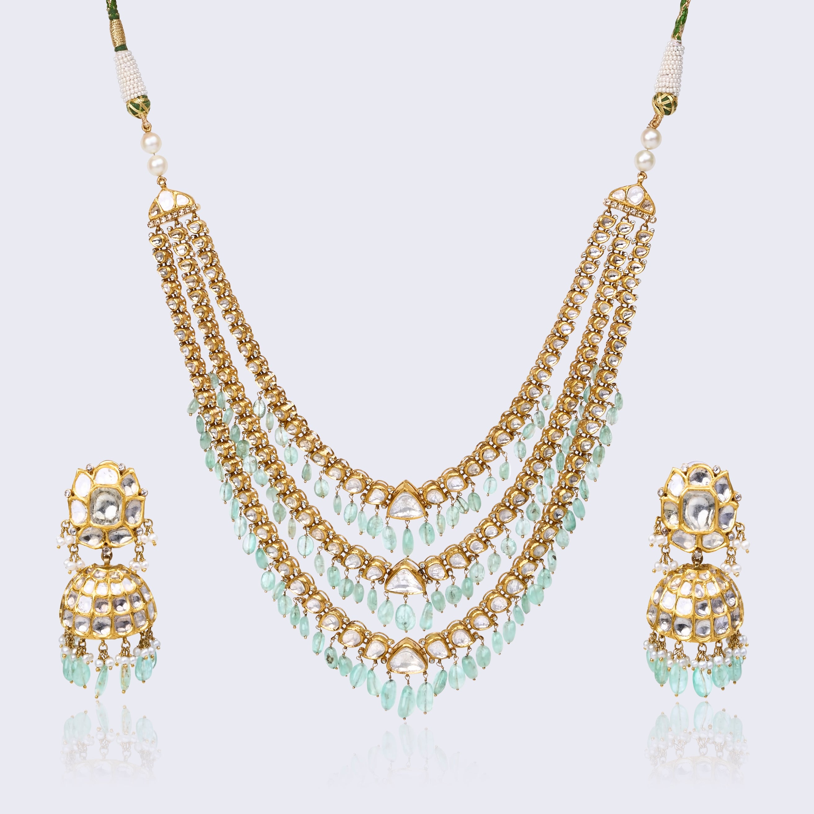Three-tiered polki necklace set with mint green drops and matching jhumka earrings