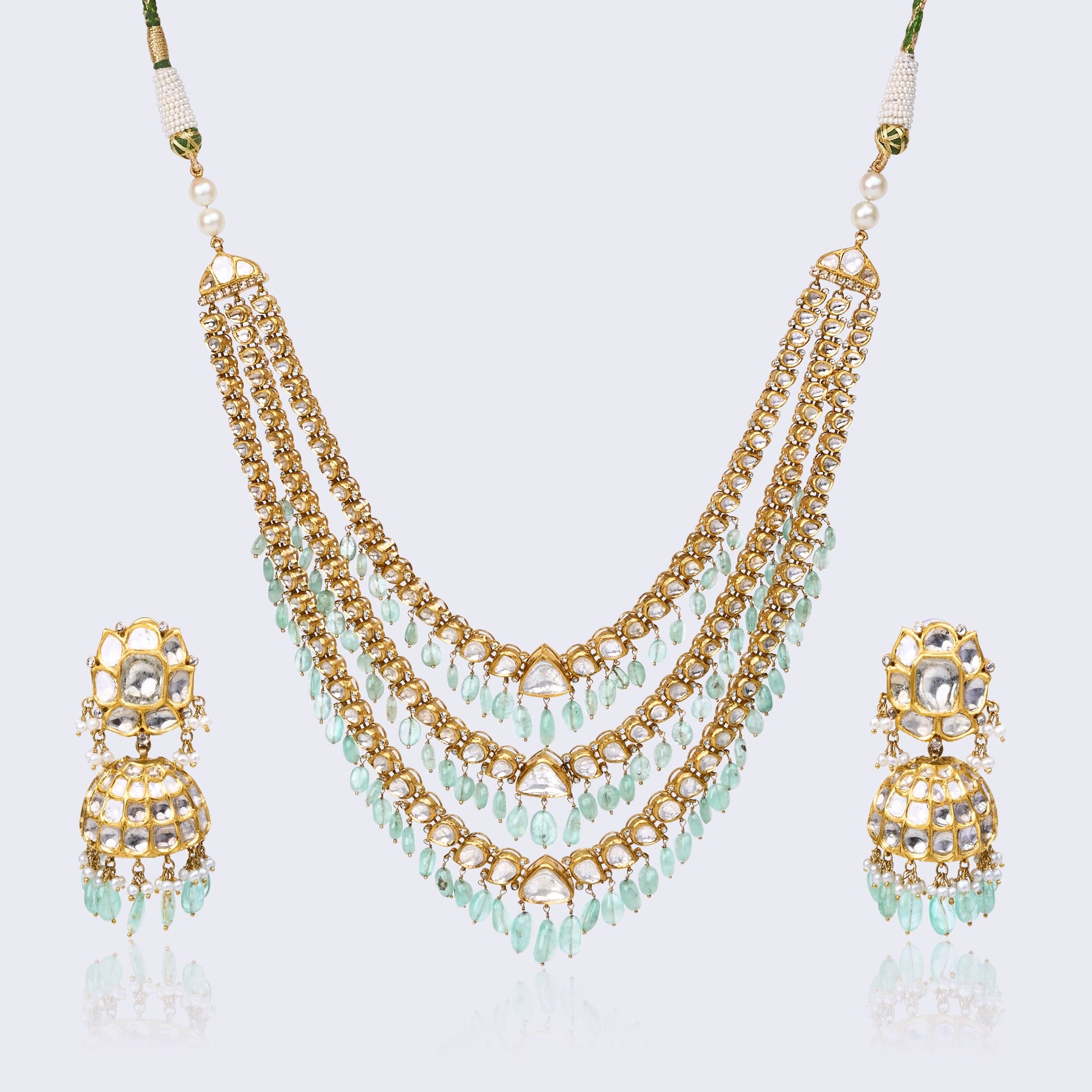 Three-tiered polki necklace set with mint green drops and matching jhumka earrings