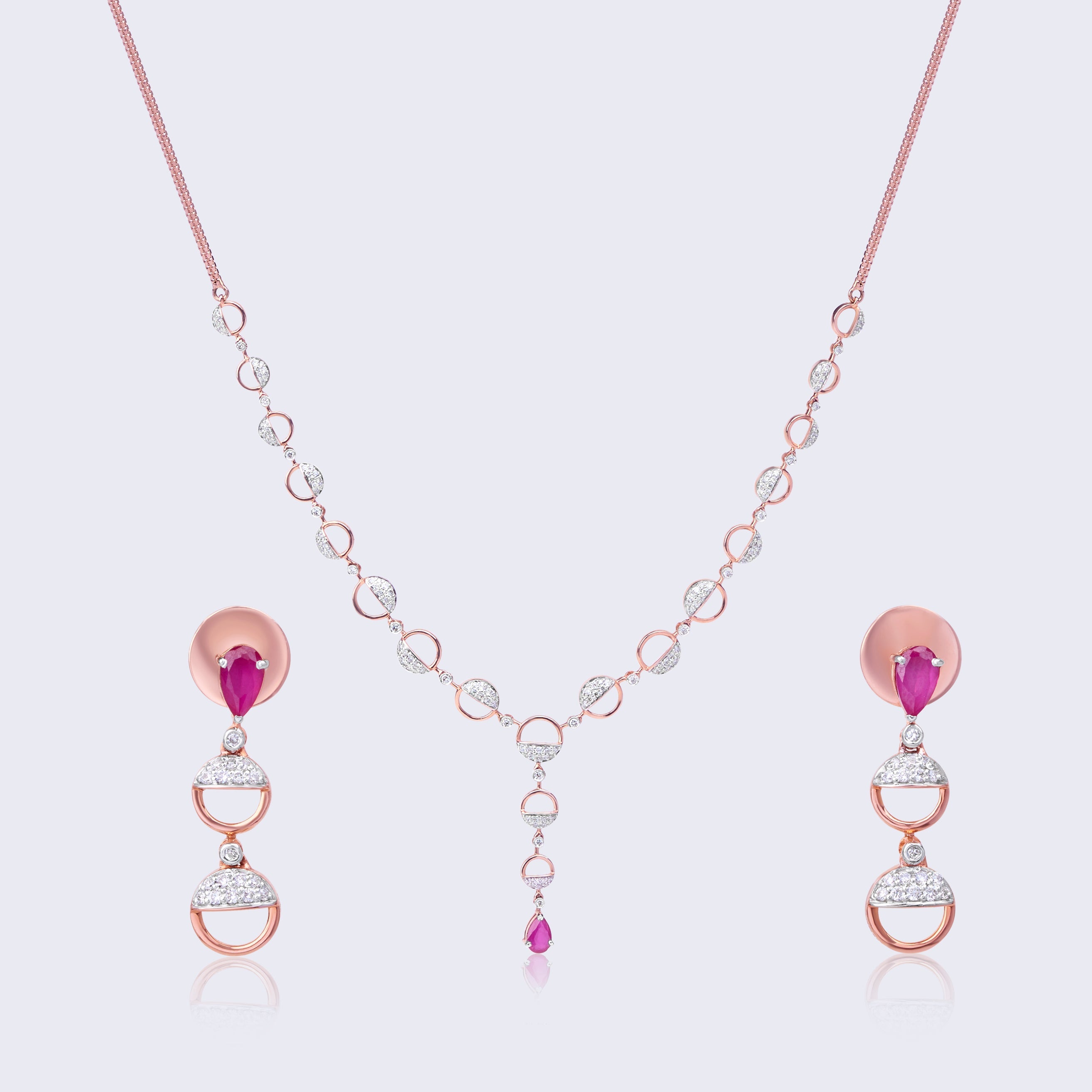 14K rose gold jewelry set with ruby accents and diamond geometric elements