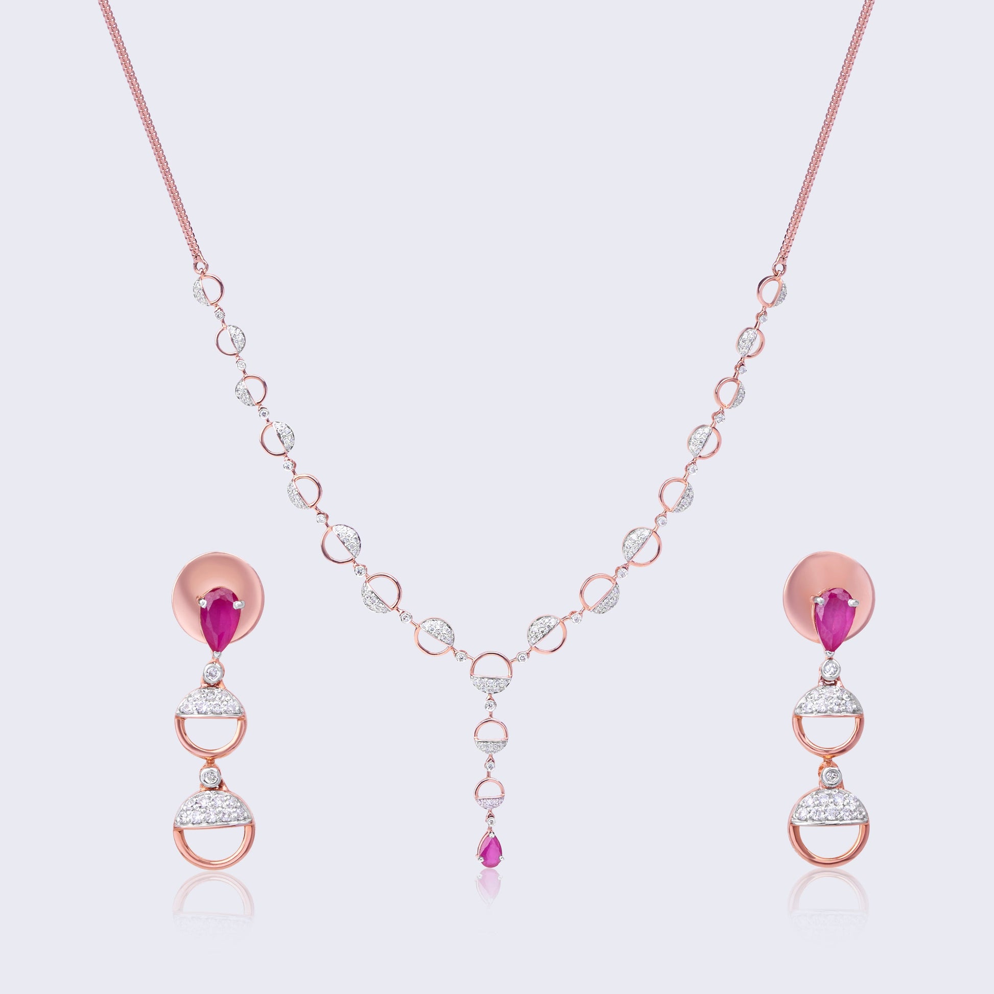 14K rose gold jewelry set with ruby accents and diamond geometric elements