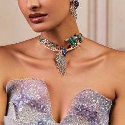 Majestic peacock necklace set with emeralds and sparkling stones, accompanied by matching earrings in 14K gold.