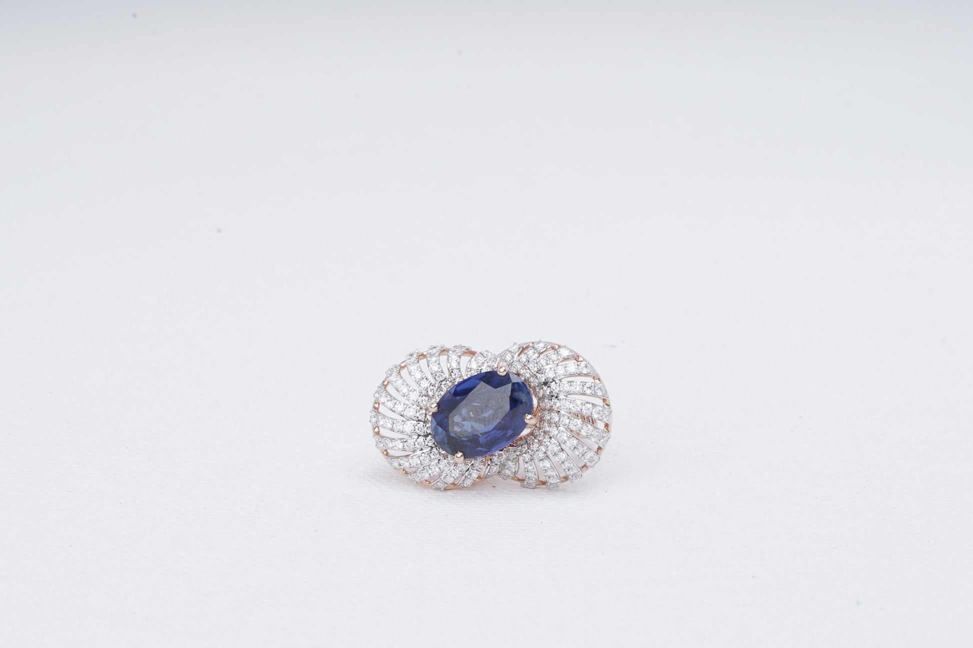 Oval blue sapphire ring with fan-style 