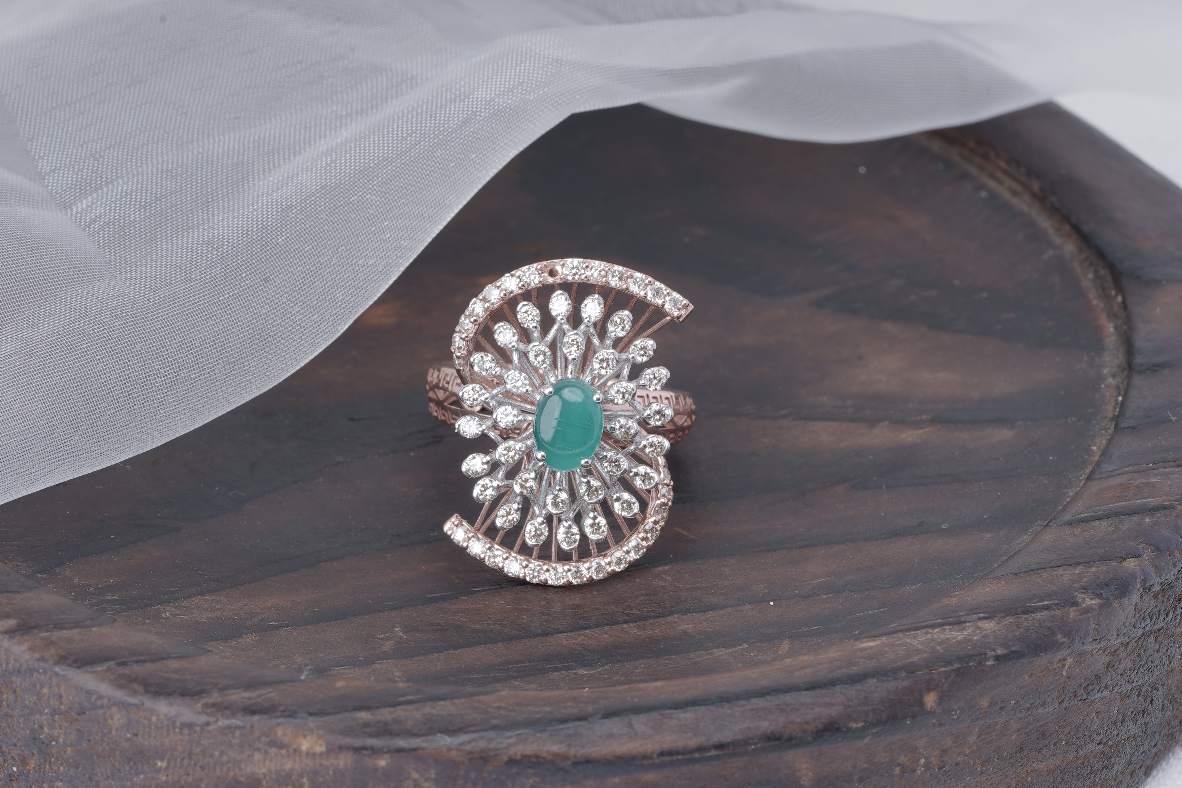  Art Deco ring with emerald center and diamond fan pattern 