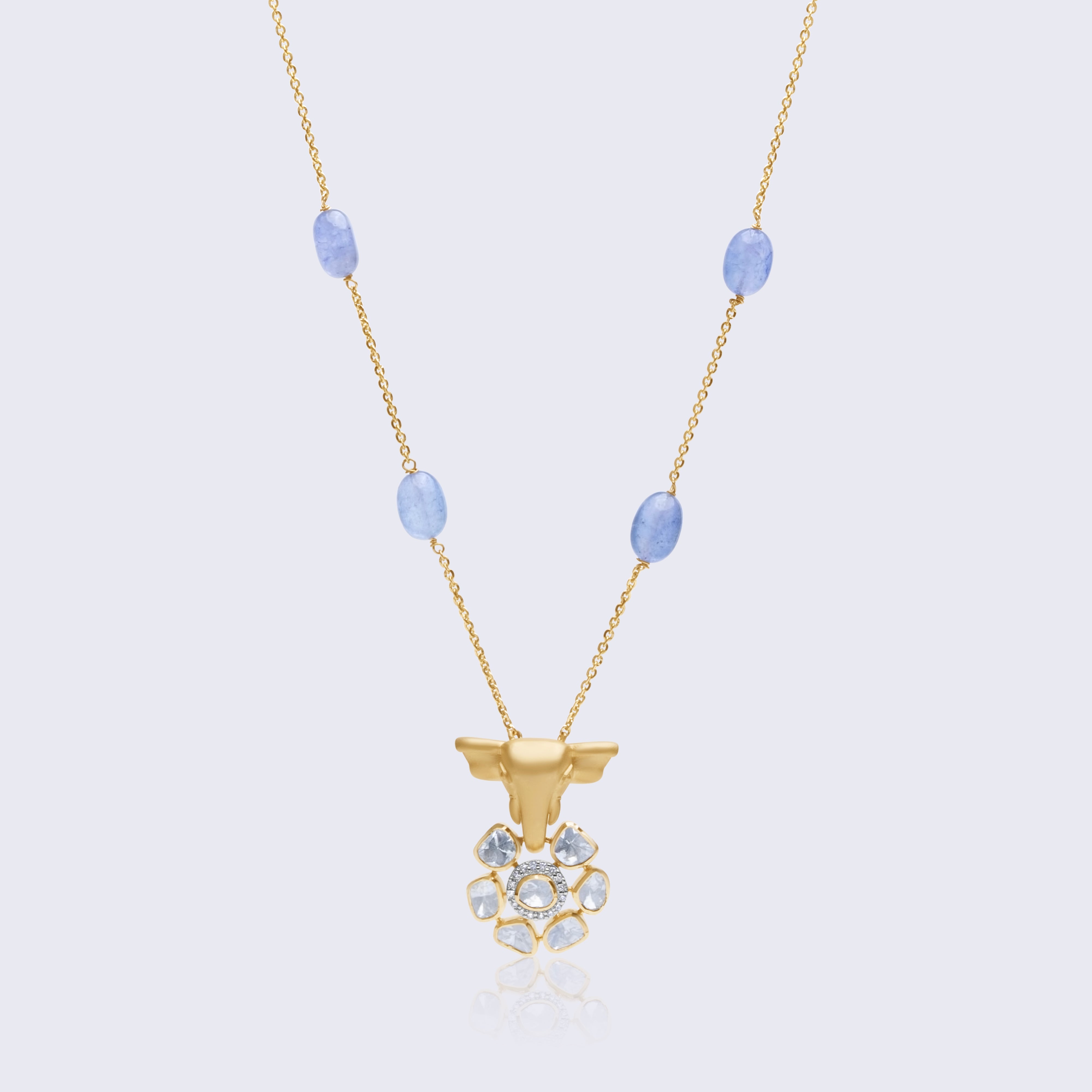 Traditional 14K gold bull polki pendant with blue chalcedony beads featuring intricate Indian craftsmanship and cultural symbolism