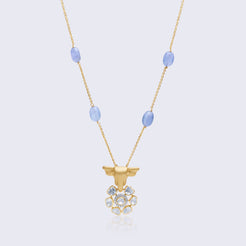 Traditional 14K gold bull polki pendant with blue chalcedony beads featuring intricate Indian craftsmanship and cultural symbolism