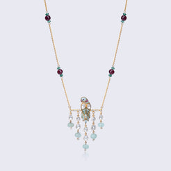 Traditional 14K gold polki pendant with ruby and emerald gemstones featuring cascading beads and intricate craftsmanship