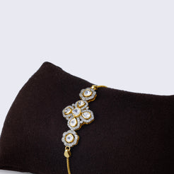 Contemporary 14K gold polki diamond cluster statement bracelet with artistic geometric pattern and rose-cut polki diamonds in varying sizes